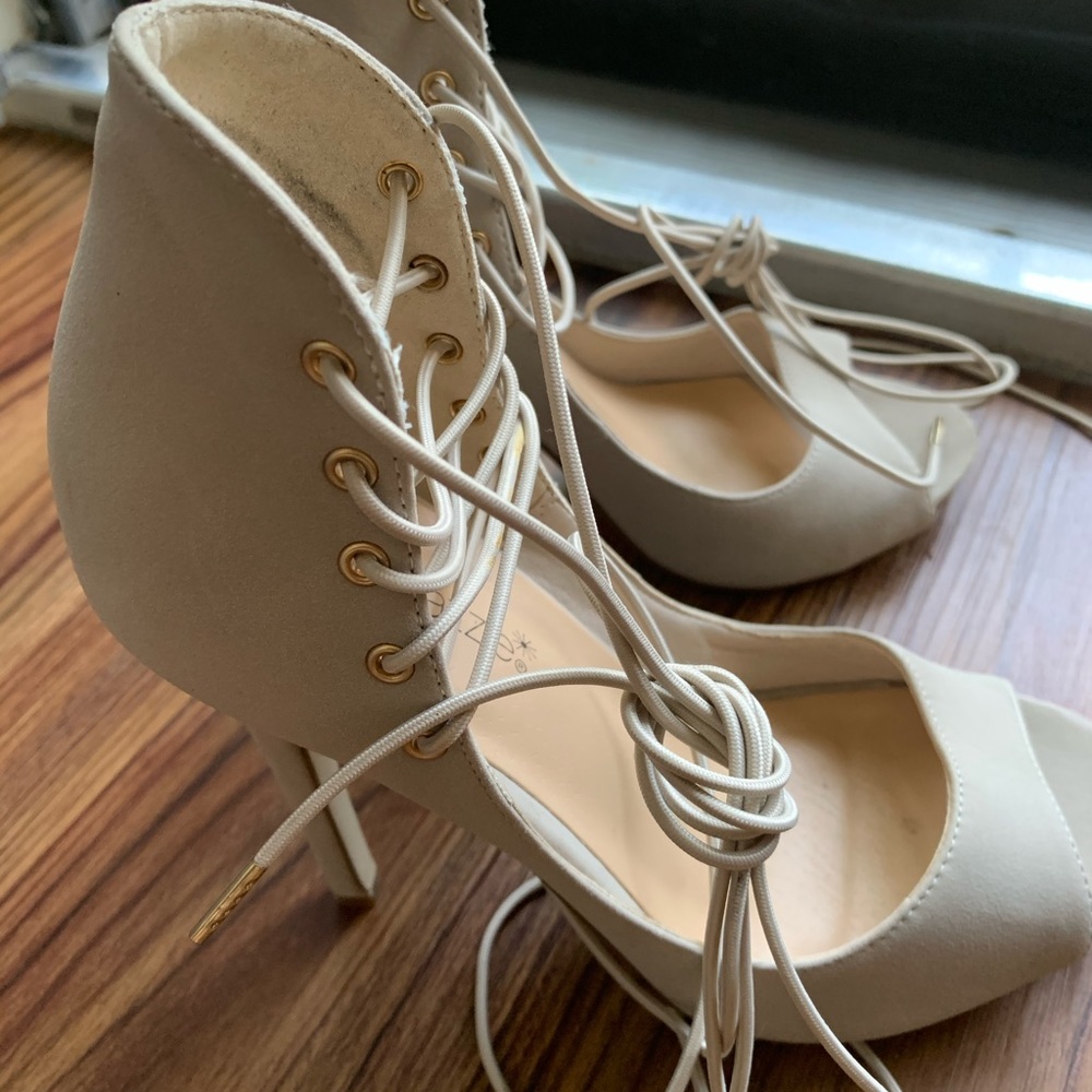 Strapped lace up high heels